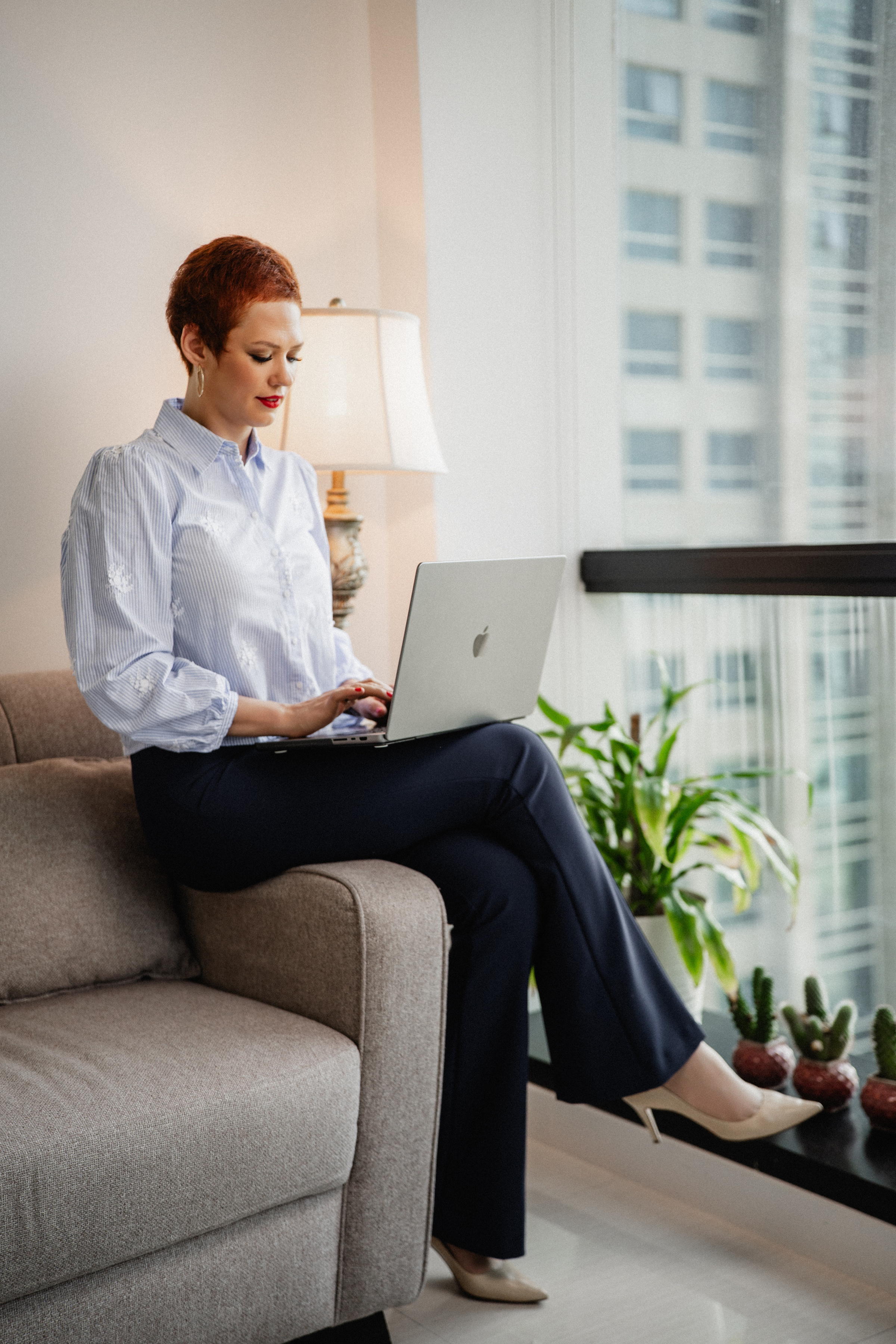 Olga Melnyk working on a MacBook